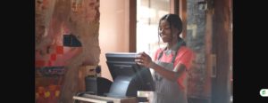 High school student working a part-time cashier job