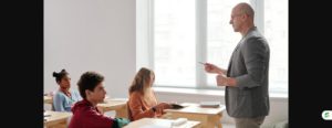 Teacher instructing a classroom of engaged students